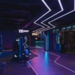 A cutting-edge virtual reality arcade featuring neon lights and immersive experiences.