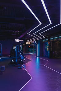 A cutting-edge virtual reality arcade featuring neon lights and immersive experiences.