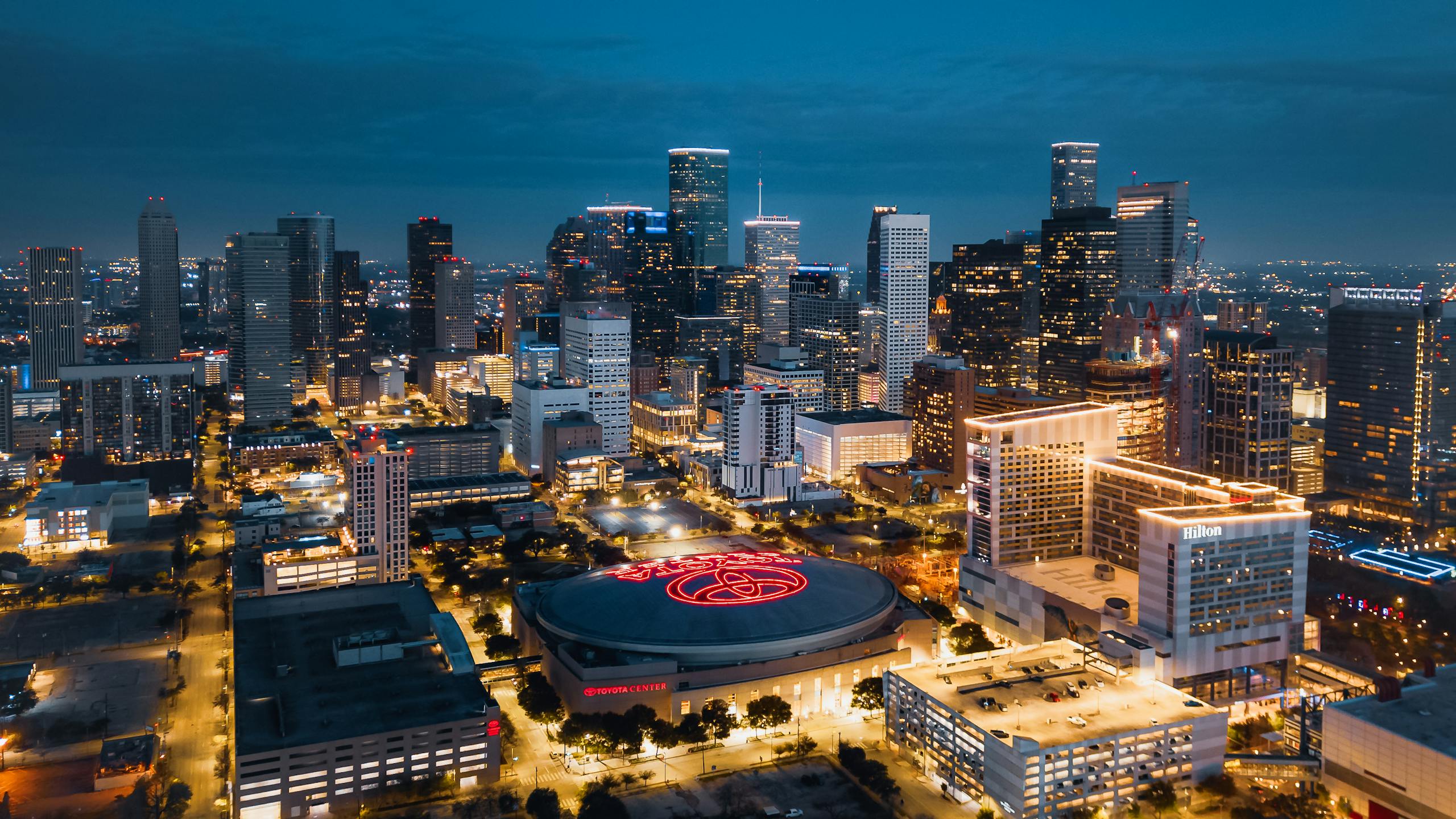 Stunning aerial panorama of Houston's illuminated skyline at night showcasing modern skyscrapers.